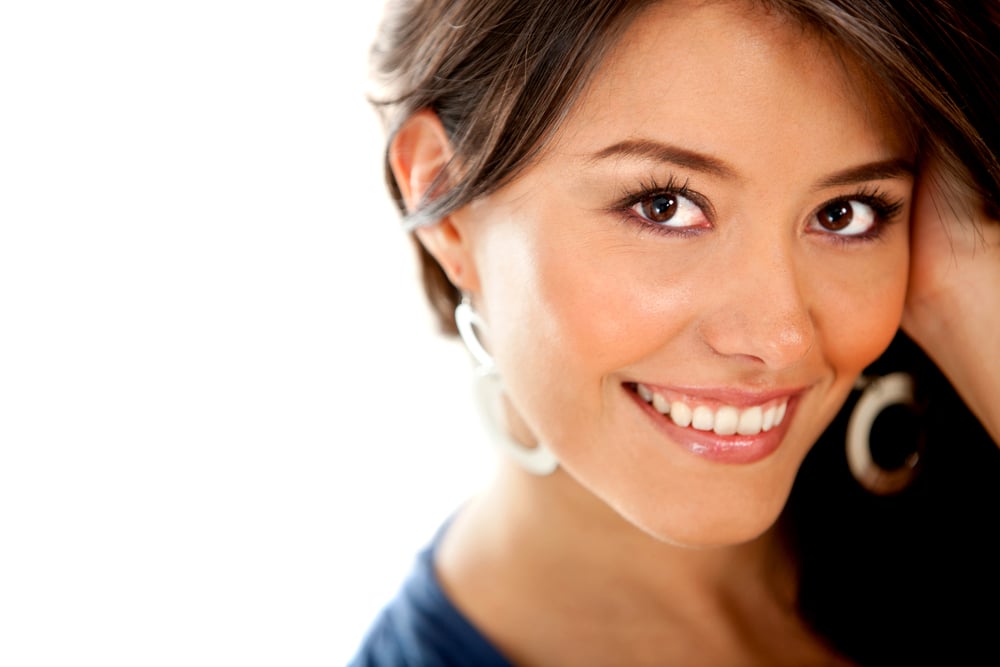 Beautiful girl smiling - isolated over a white background