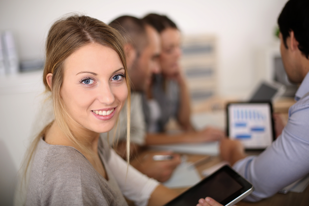 Portrait of business girl attending meeting